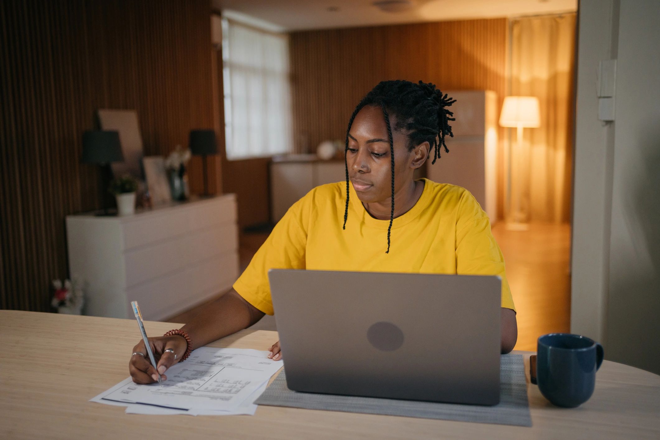 Resident reviewing finances on a laptop, representing online payments.