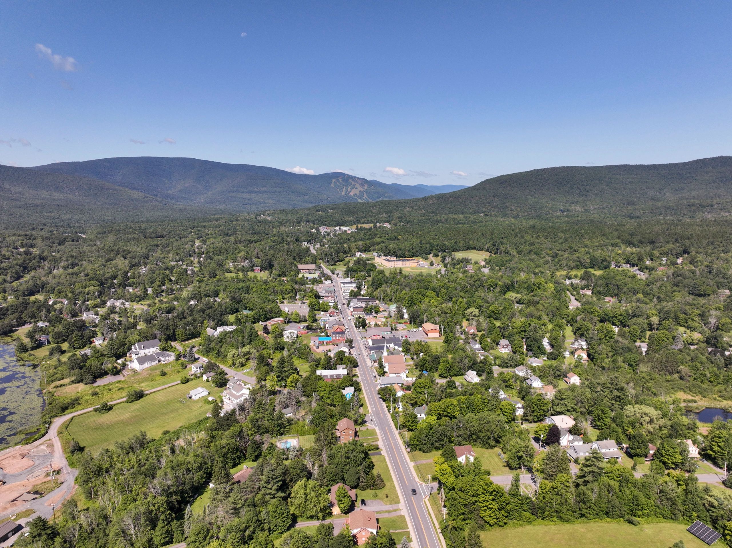 Aerial view of a New York State village and surrounding landscape