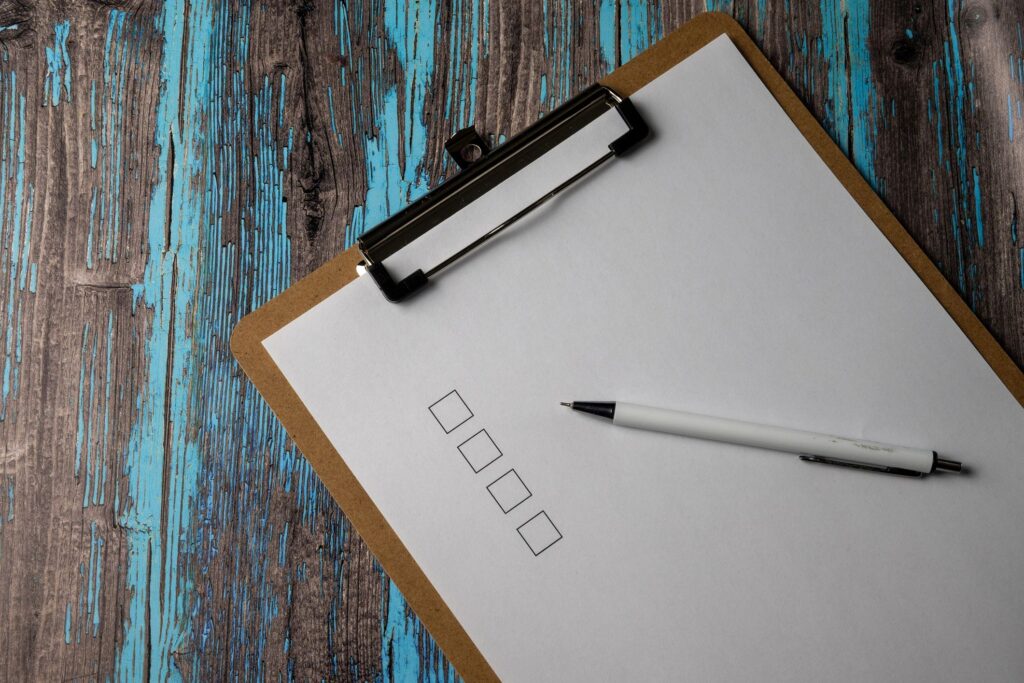 Clipboard With Blank Checklist And Pen